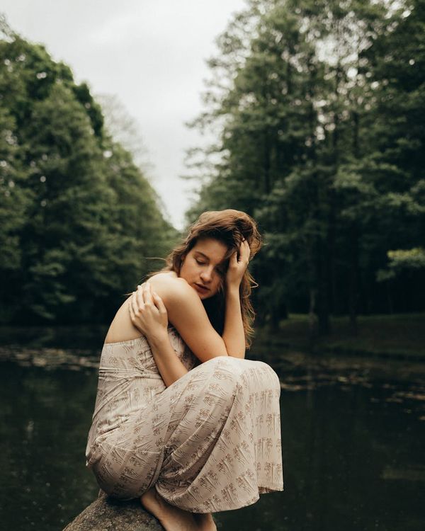 Woman feeling energized and balanced after a gentle cardio workout in a serene environment.